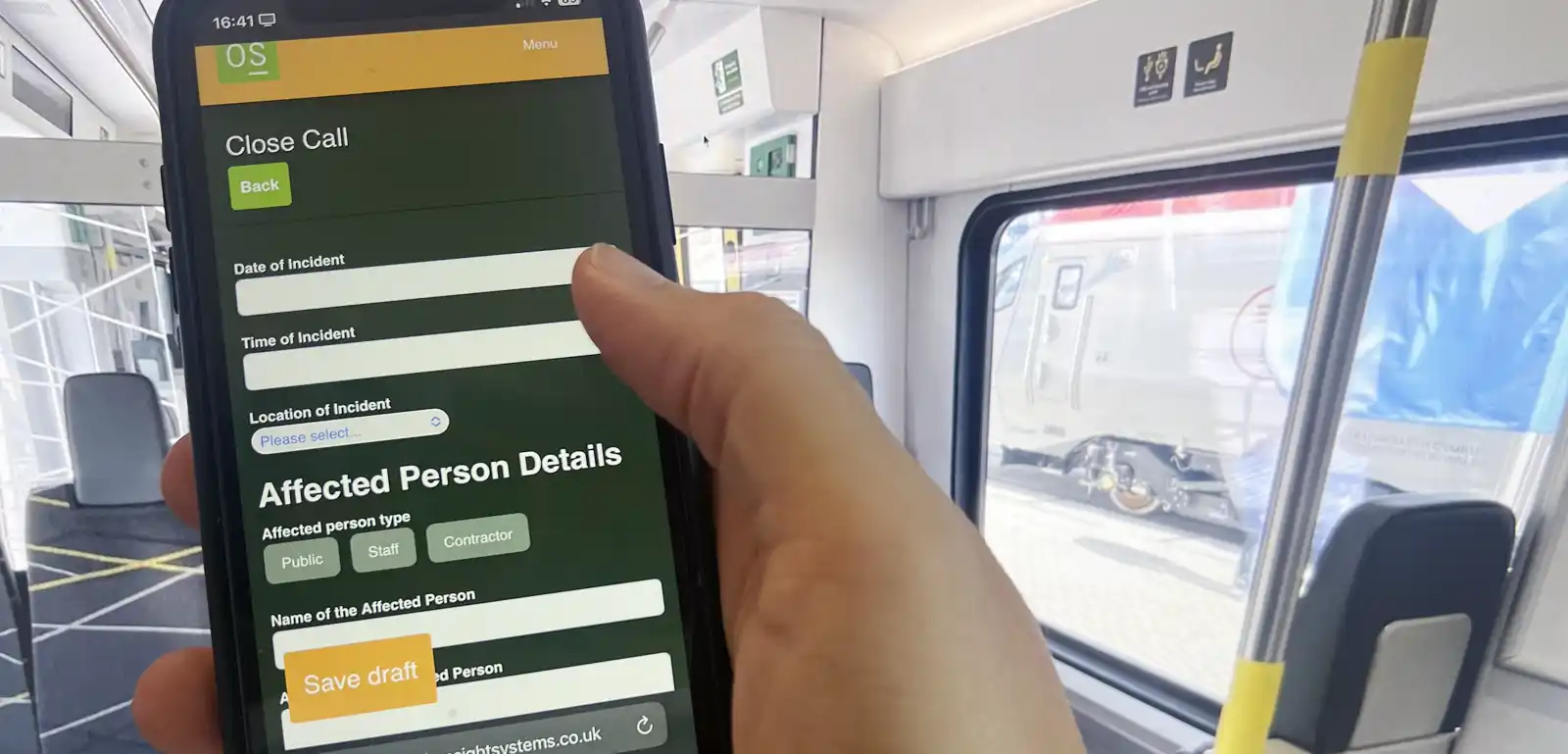 Image of the system in use with a mobile on a Merseyrail train carriage